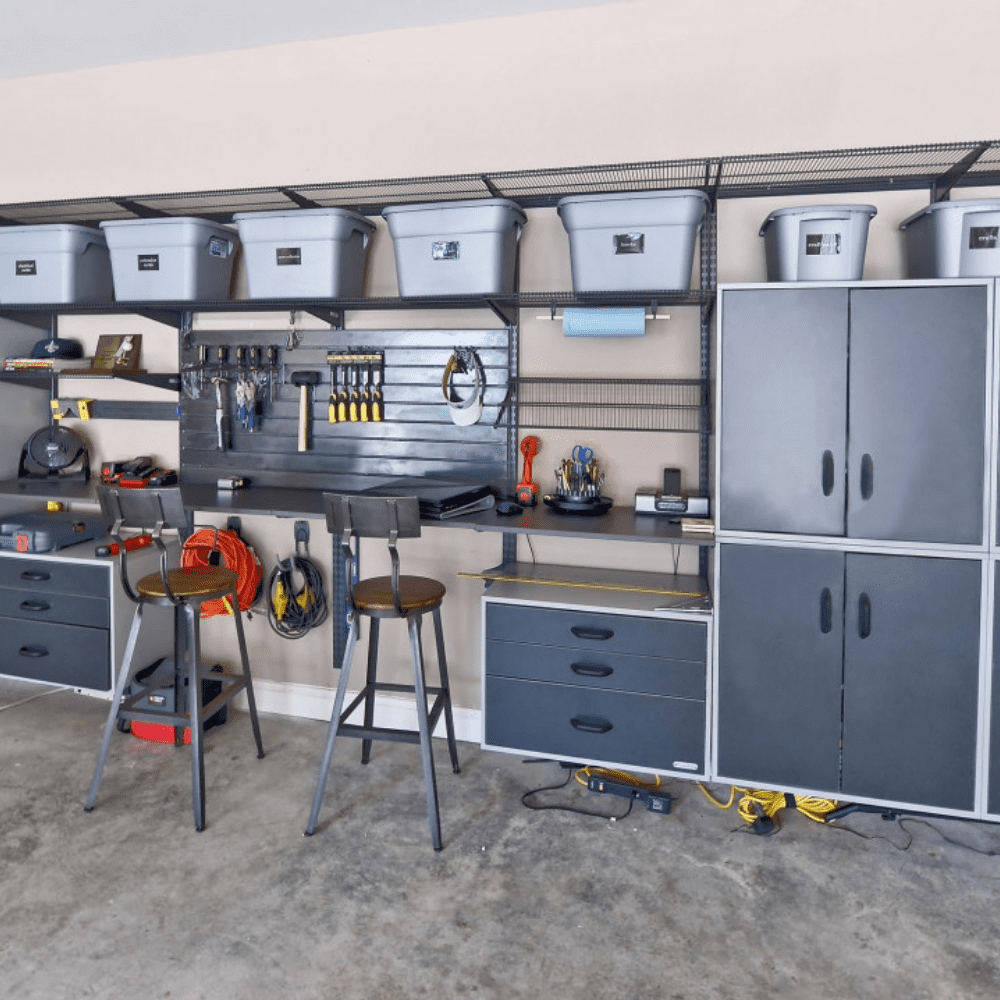 Organized garage with shelves, cabinets, and tools