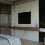 modern bedroom featuring a sleek built-in wall unit design.